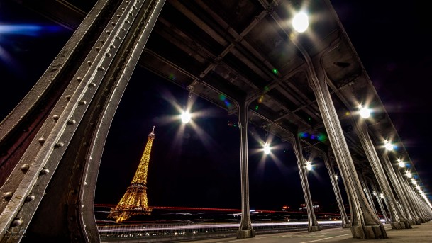 Eiffel Tower at night under bridge